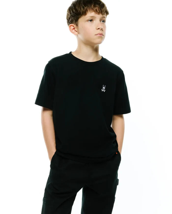 Kids Maxton Waffle Tee. Premium black classic fit waffle knit t-shirt featuring a small, crisp white embroidered Psycho Bunny skull and crossbones logo on the left chest, embodying refined streetwear style.