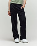 A child models Psycho Bunny’s KIDS NASH CARGO SWEATPANT - KB0800004 in green, showcasing utility cargo pockets and sweatpant comfort, with only the lower half and white sneakers visible against a plain light background.