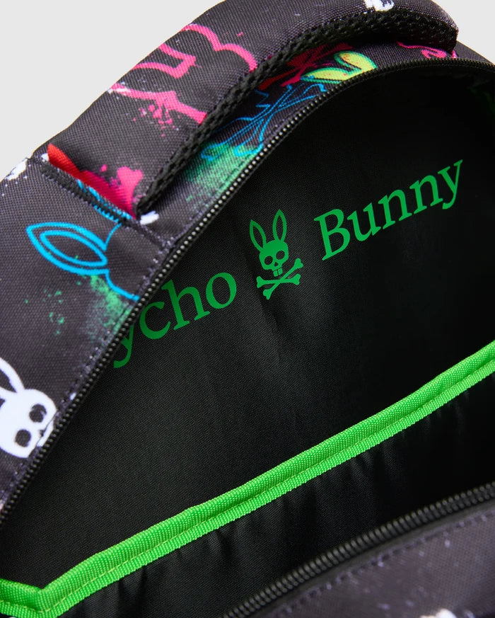 Kids Quintin Backpack in black with vibrant neon pink, blue, green, and white splatter bunny skull graphics, featuring a bright green Psycho Bunny logo and trim on the interior.