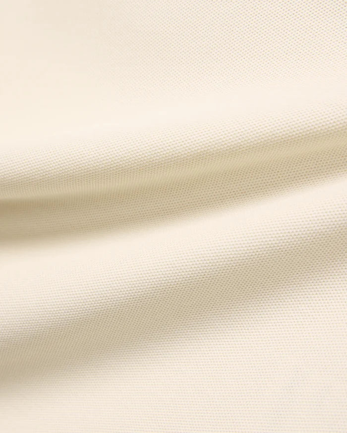 Kids Robin Pique Polo, a premium light cream polo shirt crafted from soft, breathable pique fabric, showcasing its refined, textured weave for comfort and style, perfect for everyday wear.