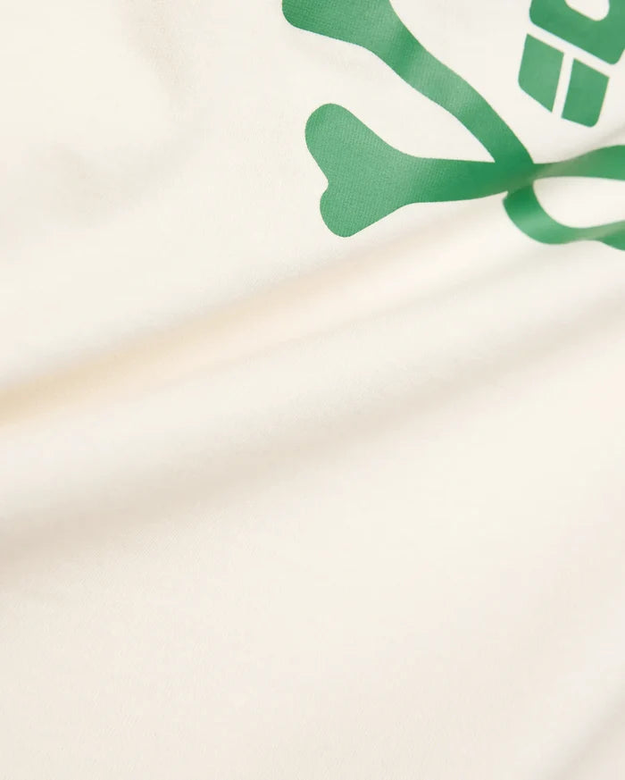 Kids Sunny Graphic Tee crafted from soft cream jersey knit, showcasing a prominent, vibrant green Psycho Bunny skull and crossbones graphic print for a comfortable classic fit.