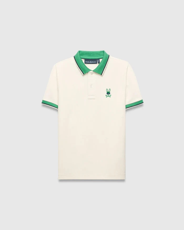 Kids Sunny Pique Polo in cream pique, classic fit, with a vibrant green collar, green and navy striped cuffs, and an embroidered green and blue Psycho Bunny skull logo on the left chest.