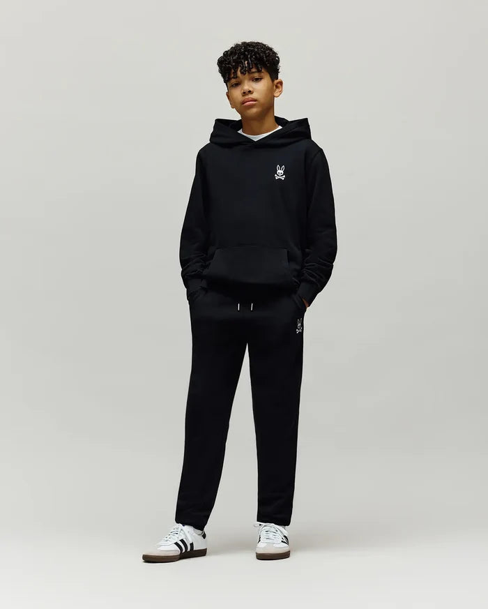 Black Kids Timothy 4k Bunny Jogger and matching hoodie, both featuring a small white embroidered Psycho Bunny skull logo on the left chest and left thigh, in a relaxed fit soft French terry fabric.