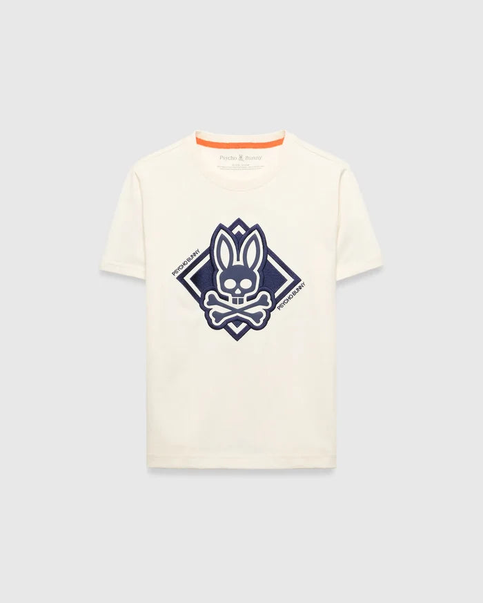 Kids Tobias Graphic Tee, a classic fit cream jersey t-shirt with a large, textured navy blue Psycho Bunny skull and crossbones logo graphic inside a diamond on the chest, featuring orange neckline trim.