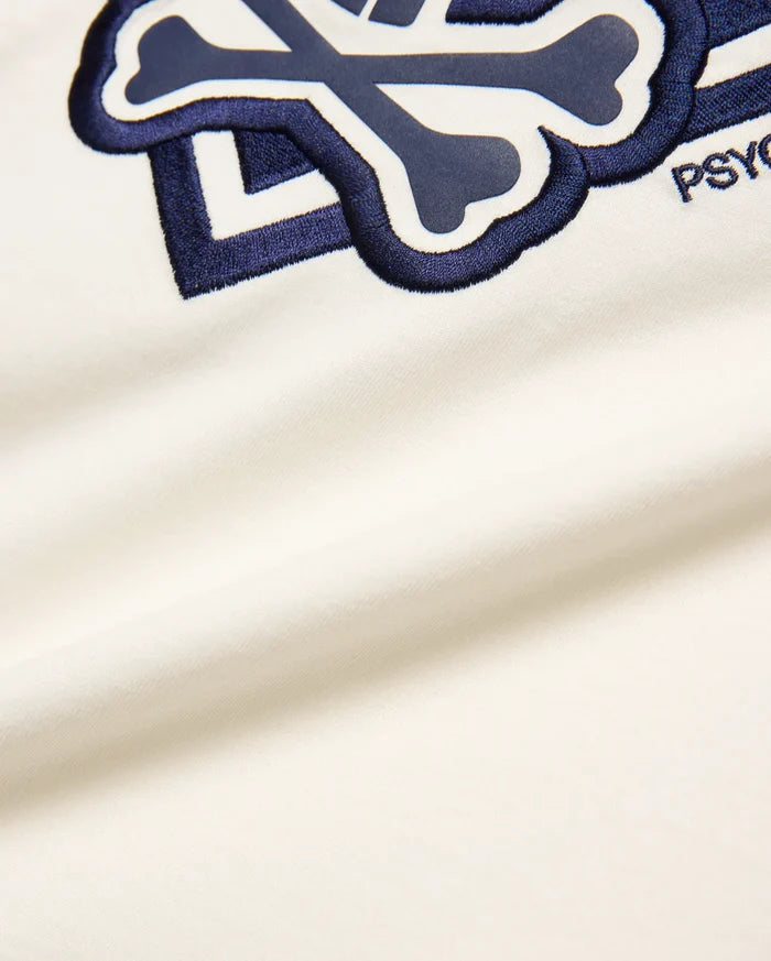 Off-white Kids Tobias Graphic Tee, soft jersey knit, featuring a large, central embroidered navy and white Psycho Bunny skull and crossbones logo with PSYCHO text.