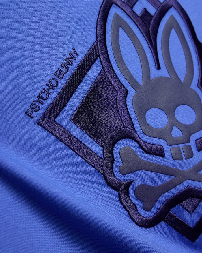 Kids Tobias Graphic Tee in vibrant blue jersey knit, featuring a large dark navy embroidered and raised Psycho Bunny skull logo with PSYCHO BUNNY text.