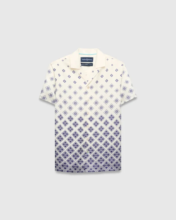 Kids Tobias Tencel Shirt in cream with a navy blue gradient diamond pattern featuring the Psycho Bunny skull logo, a relaxed fit, camp collar, and button-front.