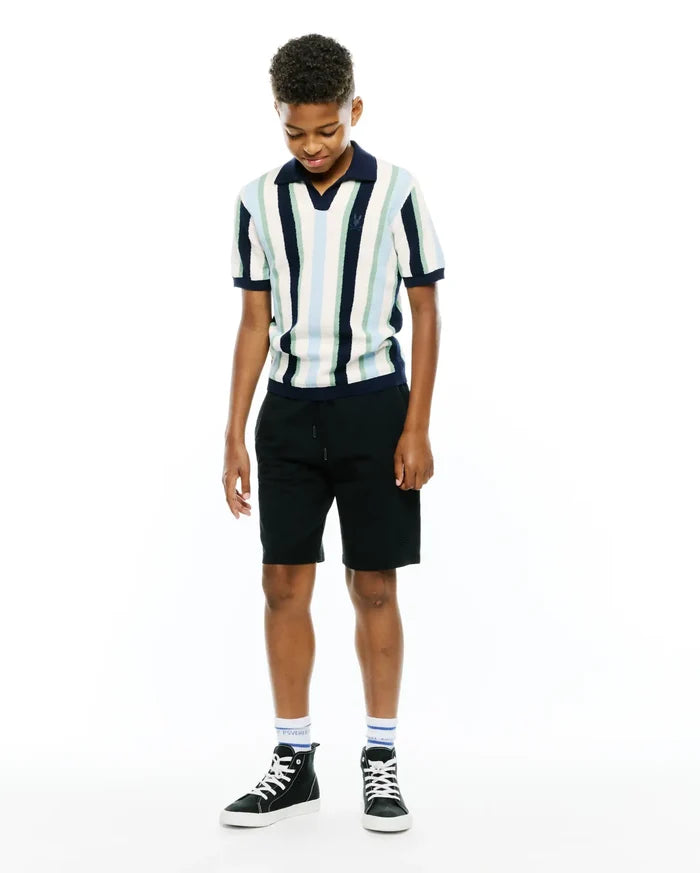 Kids Wren Stripe Knit Polo, a classic fit knit polo with vertical stripes in white, light blue, mint, and navy, featuring a navy collar and cuffs, and a small embroidered Psycho Bunny skull logo on the left chest.