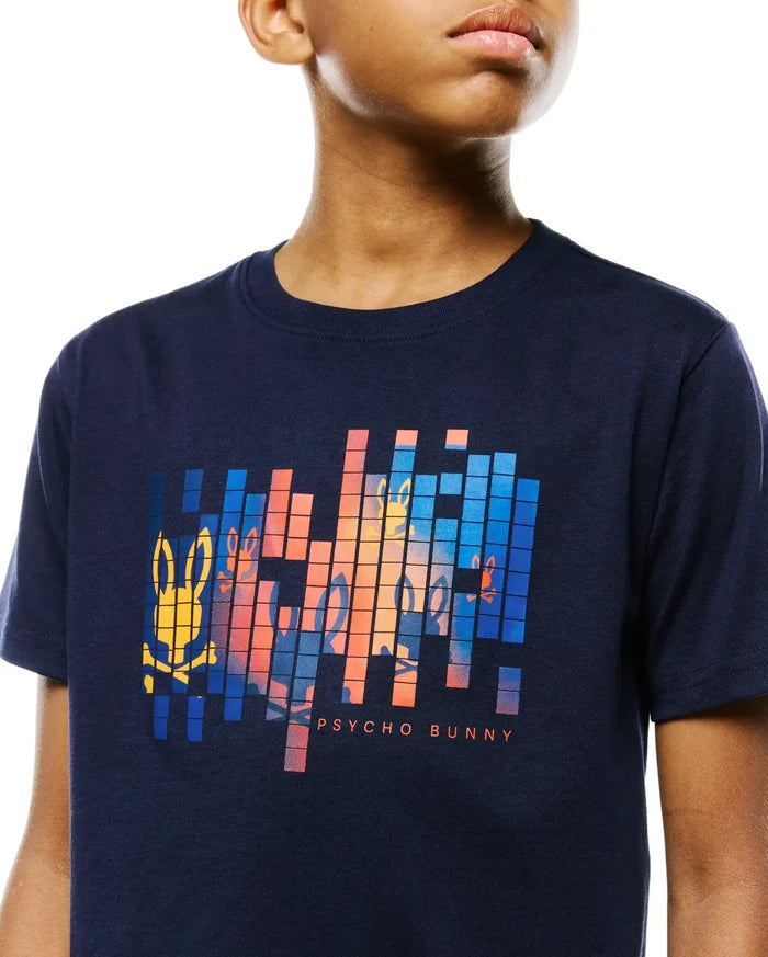 Kids Zander Graphic Tee in navy jersey, featuring a large pixelated chest graphic with orange, blue, and yellow Psycho Bunny skull logos and text, in a classic fit.