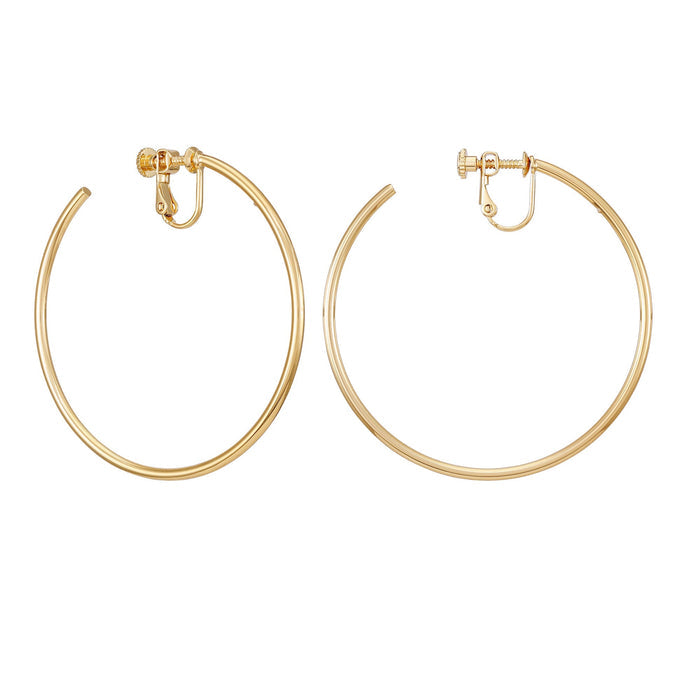 A pair of Vince Camuto Large Open Hoop Clip On Earrings, featuring a trendy gold design perfect for daily wear, displayed against a white background.
