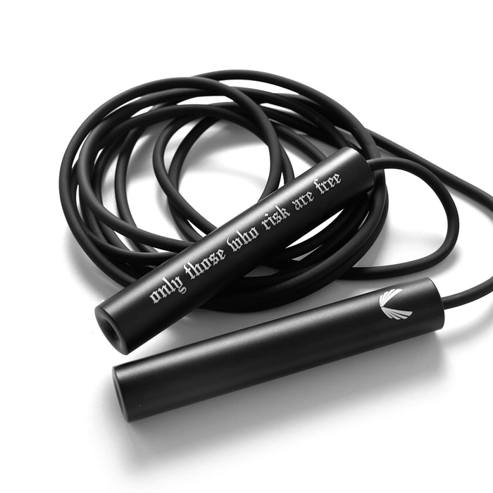 flatlay Mantra Jump Rope in black with coiled cable on white background