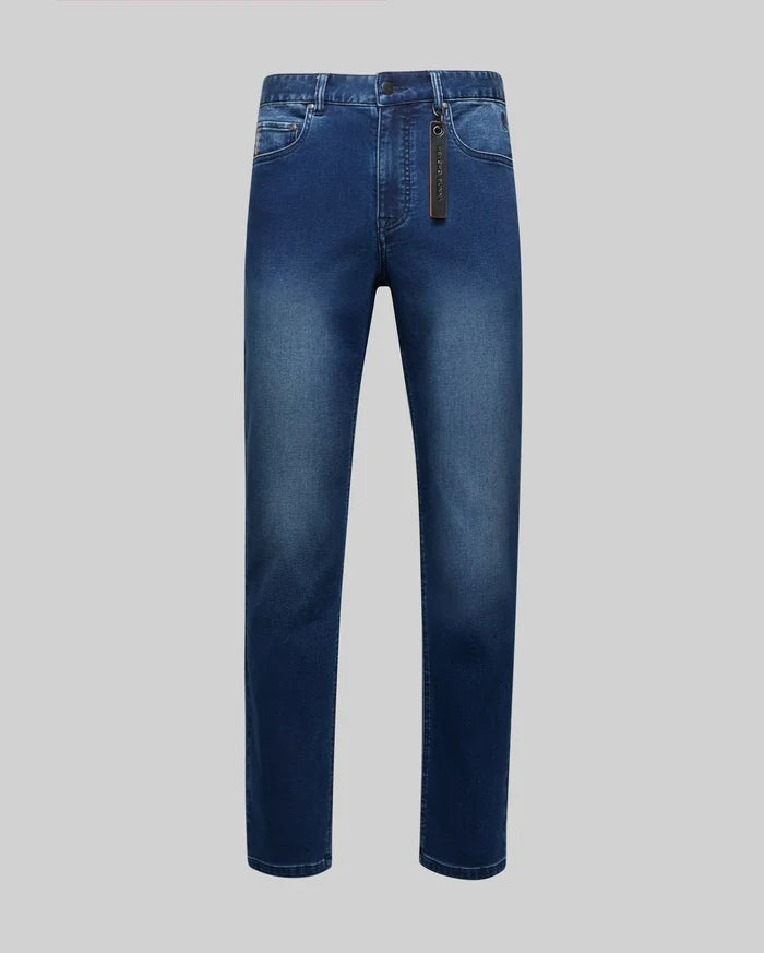Mens Ace Knit Denim Pant, dark blue faded wash, straight fit knit denim with classic five-pocket styling, small red stitching on coin pocket, and a prominent black Psycho Bunny tag.