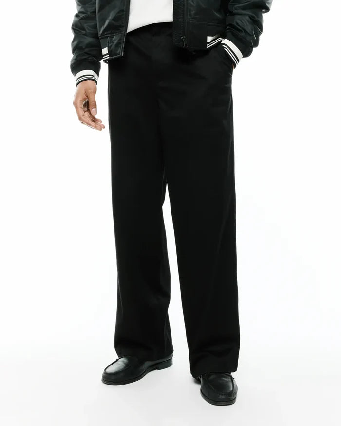 Mens Aidan Chino Pant, a sleek black premium menswear piece, featuring a relaxed, wide-leg fit and smooth, durable chino fabric, ideal for modern streetwear aesthetics.