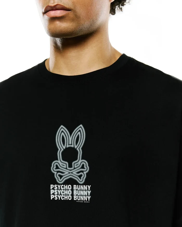 Mens Alex Relaxed Back Graphic Tee, a black jersey knit t-shirt featuring a large white outlined Psycho Bunny skull logo and stacked PSYCHO BUNNY text print on the chest.