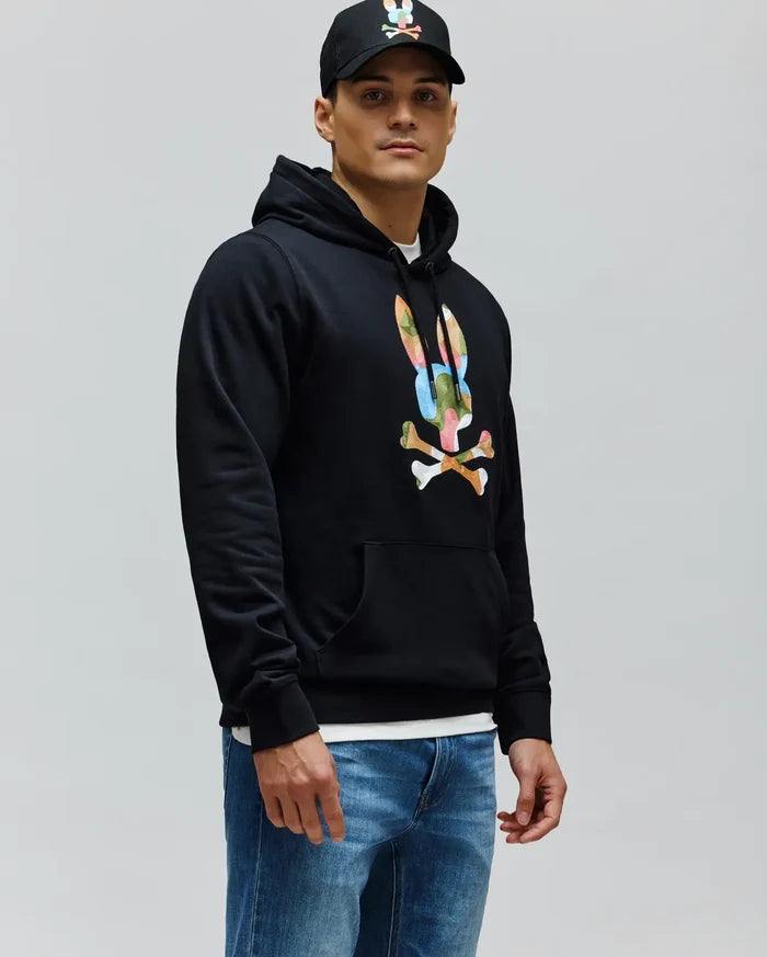 Mens Ara Hoodie, a black classic fit French terry hoodie featuring a large, vibrant multi-color Psycho Bunny skull and crossbones logo on the chest, with a drawstring hood and kangaroo pocket.