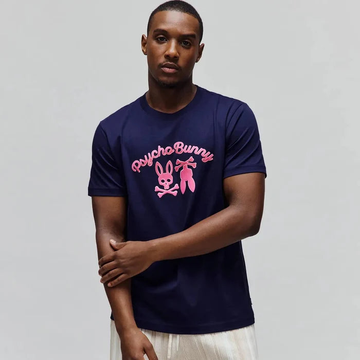 Mens Aram Graphic Tee, navy blue classic fit jersey knit t-shirt with a large hot pink Psycho Bunny script and iconic bunny skull logo graphic centered on the chest.