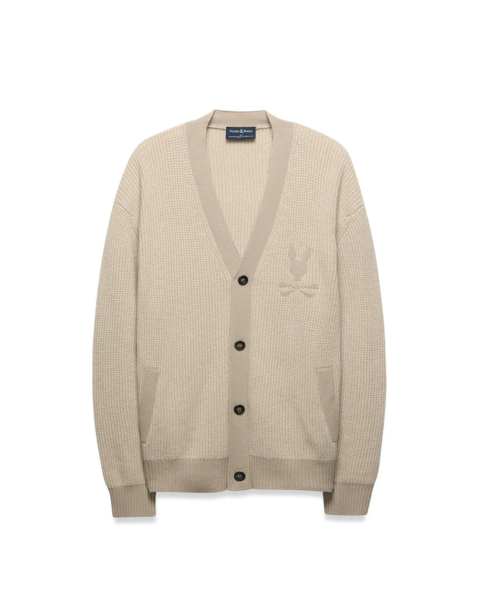 Mens Atkinson Cardigan in beige waffle knit, relaxed fit, with V-neck, dark buttons, front patch pockets, and a tone-on-tone embroidered Psycho Bunny skull logo on the left chest.