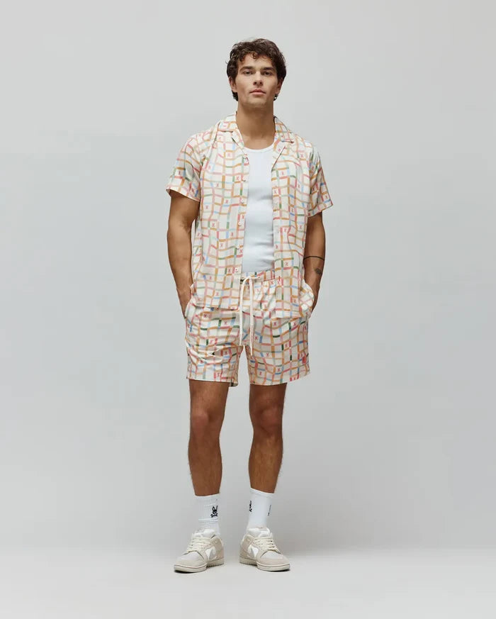 Mens Atlas Tencel Shirt and matching shorts in a relaxed fit, featuring an off-white base with a vibrant multi-colored grid pattern and small repeated Psycho Bunny skull logos.