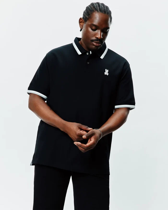 MENS BIG AND TALL HOLDEN PIQUE POLO in black, featuring a classic fit, white tipping on the collar and cuffs, and a small embroidered Psycho Bunny skull logo on the left chest.