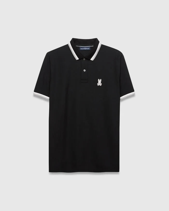 Mens Big And Tall Holden Pique Polo in black pique fabric, featuring a classic fit, white and grey striped collar and cuffs, and a small embroidered white Psycho Bunny skull logo on the left chest.