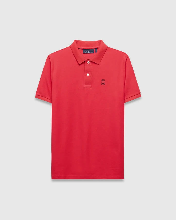 Mens Blythe Pique Polo in vibrant red, featuring a classic fit, pique texture, two-button placket with white buttons, and a small black embroidered Psycho Bunny skull logo on the left chest.