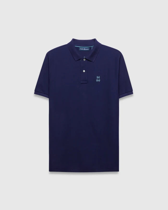 Mens Blythe Pique Polo in navy, classic fit, featuring a light blue embroidered Psycho Bunny skull logo on the left chest and subtle light blue collar trim.