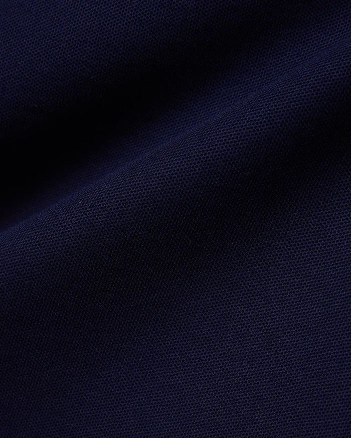 Deep navy Mens Blythe Pique Polo, featuring a classic fit, textured pique fabric, and the iconic small embroidered Psycho Bunny skull logo on the chest.