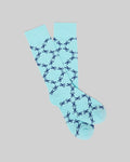Mens Bunny Dress Sock in vibrant aqua blue, featuring a refined smooth knit and an all-over repeating dark blue Psycho Bunny skull logo pattern.
