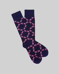 Mens Bunny Dress Sock by Psycho Bunny, navy with an all-over pink bunny skull logo pattern in a diamond grid, crafted from fine knit fabric.