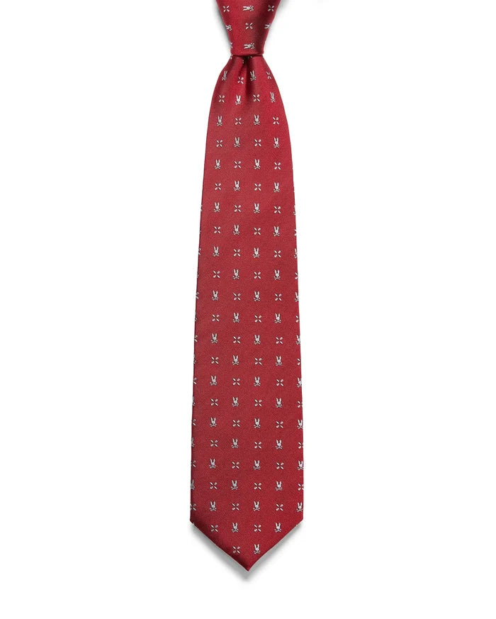 Mens Bunny Neat Woven Tie, a rich red woven tie with a subtle diagonal texture, featuring a repeating pattern of small white Psycho Bunny skull logos and 'X' marks.