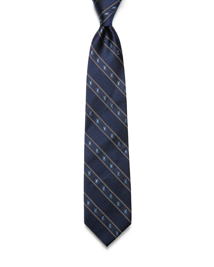 MENS BUNNY STRIPE WOVEN TIE in navy blue, featuring diagonal tan stripes and repeating small light blue Psycho Bunny skull logos in a refined woven texture.