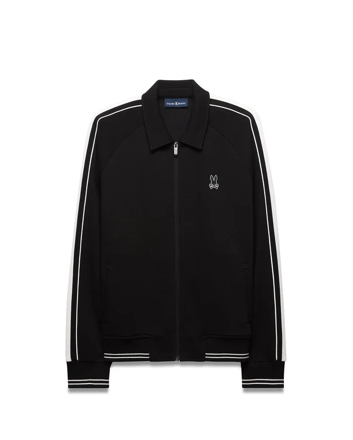 Mens Ceano Track Jacket, black smooth knit with a classic fit, featuring white double stripes on raglan sleeves, ribbed collar, cuffs, and hem, and a small embroidered white Psycho Bunny skull logo on the left chest.