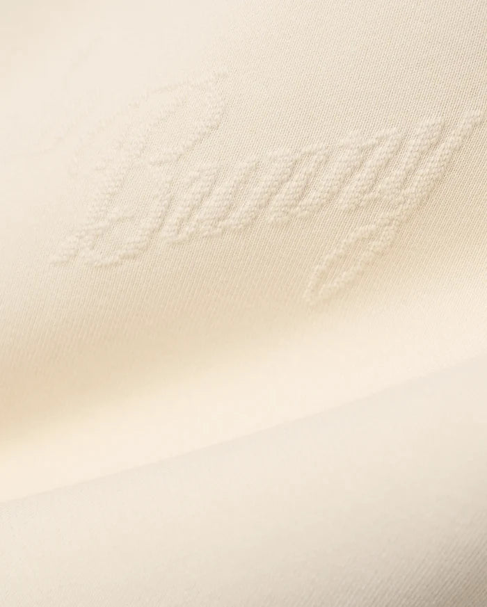 Mens Cedrick All Over Jacquard Crew in creamy off-white, featuring a subtle raised jacquard knit pattern of the word Bunny throughout the fabric.