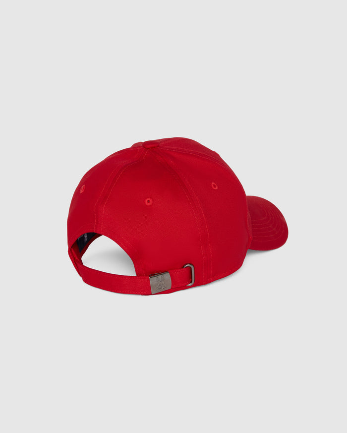 A red Psycho Bunny MENS CLASSIC BASEBALL CAP - B6A816A1HT viewed from the back. Made from 100% cotton, the cap features an adjustable strap with a metal buckle for size customization. The background is plain and light grey.