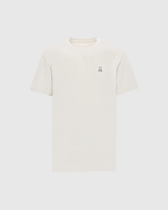 The Psycho Bunny Men's Classic Crew Neck Tee (B6U014B200) in light beige is a premium Pima cotton shirt with short sleeves and an embroidered bunny logo on the upper left chest. Set against a simple white background, it embodies timeless appeal.