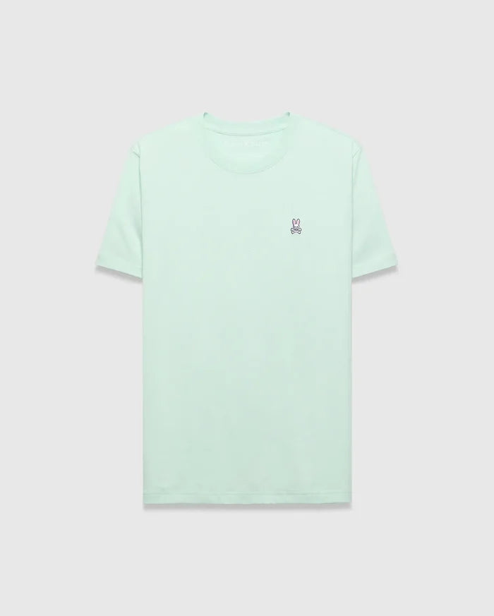 Mens Classic Crew Neck Tee in mint green, featuring a classic fit and soft jersey fabric. A small, embroidered pink and purple Psycho Bunny skull logo is on the left chest.