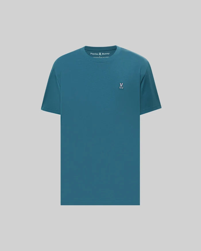 Mens Classic Crew Neck Tee in teal, featuring a classic fit and smooth jersey knit. Small embroidered Psycho Bunny skull logo in pink, white, and black on the left chest.