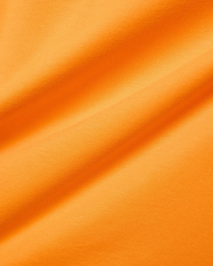 Mens Classic Crew Neck Tee in vibrant orange, crafted from soft jersey knit fabric with subtle folds, reflecting Psycho Bunny's bold, refined streetwear aesthetic.