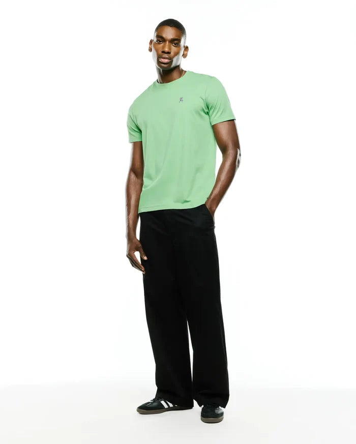 Men's Classic Pima Crew Neck Tee in light green, featuring a classic fit and smooth Pima cotton jersey fabric. A small, embroidered dark blue Psycho Bunny skull logo is on the left chest.