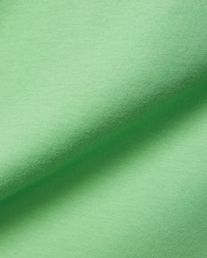 Psycho Bunny Mens Classic Crew Neck Tee in vibrant lime green, crafted from premium, ultra-soft jersey knit fabric, showcasing subtle texture and elegant folds.