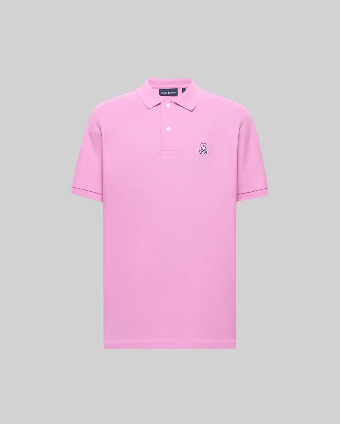 Mens Classic Pique Polo in vibrant pink, featuring a classic fit, pique knit texture, two white buttons, and a small black and white embroidered Psycho Bunny skull logo on the left chest.
