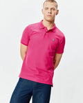 Mens Classic Pique Polo in vibrant hot pink, featuring a classic fit, pique knit texture, two white button placket, and a small embroidered Psycho Bunny skull logo on the left chest.