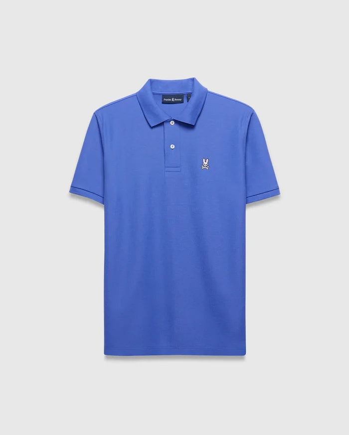 Mens Classic Pique Polo in vibrant blue, a classic fit pique knit shirt with a two-button placket, ribbed collar, and small embroidered Psycho Bunny skull logo on the left chest.