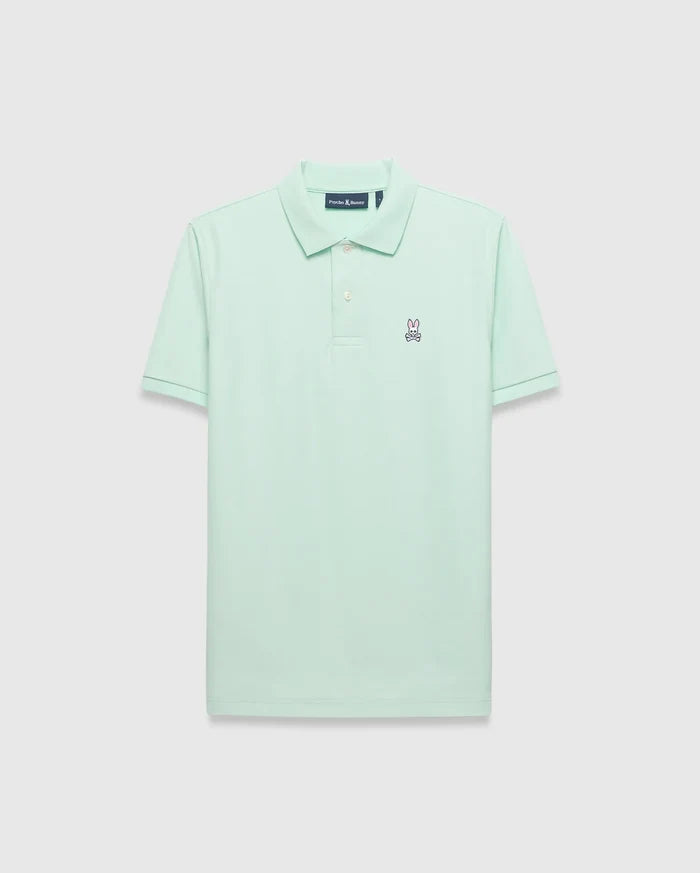 Mens Classic Pique Polo in mint green, featuring a classic fit and pique texture. Small embroidered pink and navy Psycho Bunny skull logo on the left chest with white buttons.