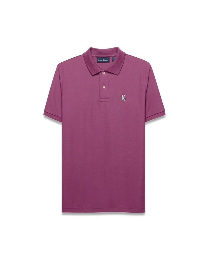 Mens Classic Pique Polo in plum, featuring a classic fit, pique texture, and a small white embroidered Psycho Bunny skull logo on the left chest with a two-button placket.