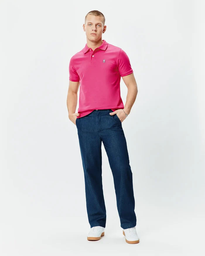 Mens Classic Pique Polo in vibrant pink, featuring a classic fit, two-button placket, and small embroidered Psycho Bunny skull logo on the left chest.