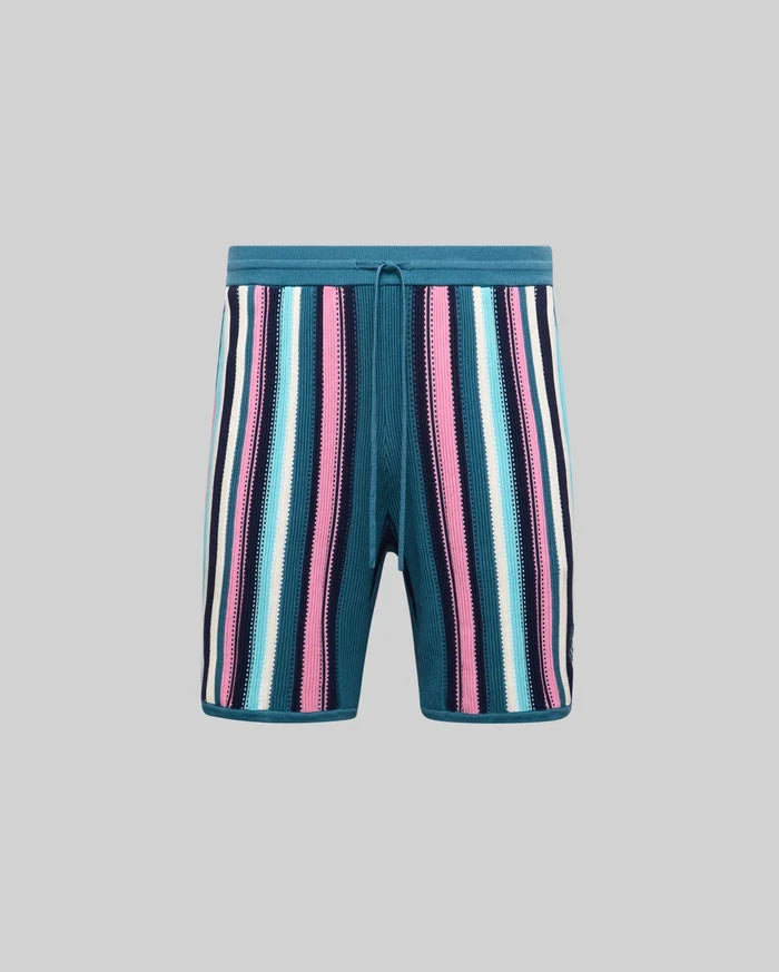 Mens Cliff Knit Short in teal with bold vertical stripes in pink, light blue, white, and navy, featuring a relaxed fit, textured knit fabric, and a small embroidered Psycho Bunny skull logo on the left leg.