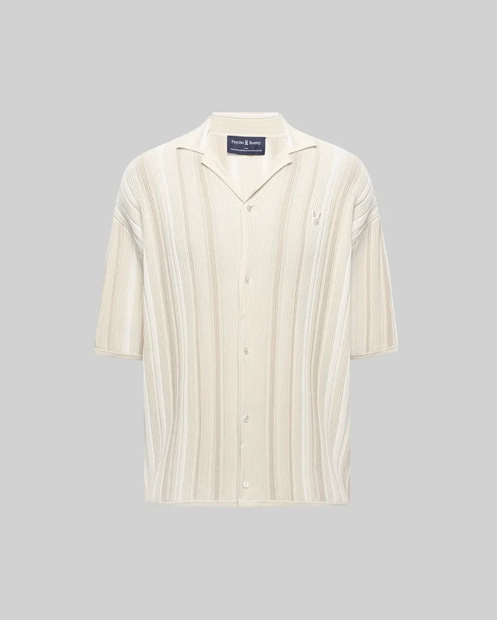 Mens Cliff Shirt, a relaxed fit cream and beige striped ribbed knit button-up with a camp collar, short sleeves, and a small embroidered Psycho Bunny skull logo on the left chest.