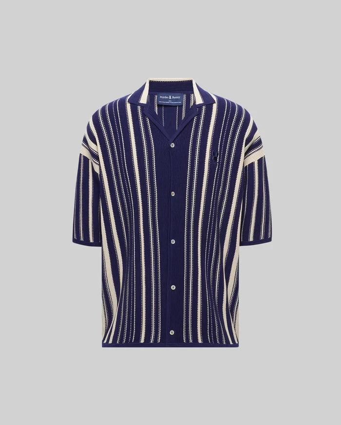 Mens Cliff Shirt, a navy blue and cream vertical striped ribbed knit short-sleeve shirt with a relaxed fit, spread collar, button-front, and small embroidered Psycho Bunny skull logo on the left chest.