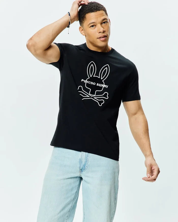 Mens Craig Graphic Tee, black classic fit jersey knit with a large white Psycho Bunny skull and crossbones logo and text graphic prominently displayed on the chest.